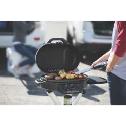 Coleman RoadTrip® 225 Portable Stand-Up Propane Grill -Outdoor camping equipment-Coleman 2000033048 coleman grill 225 su black close up of food on grate in use